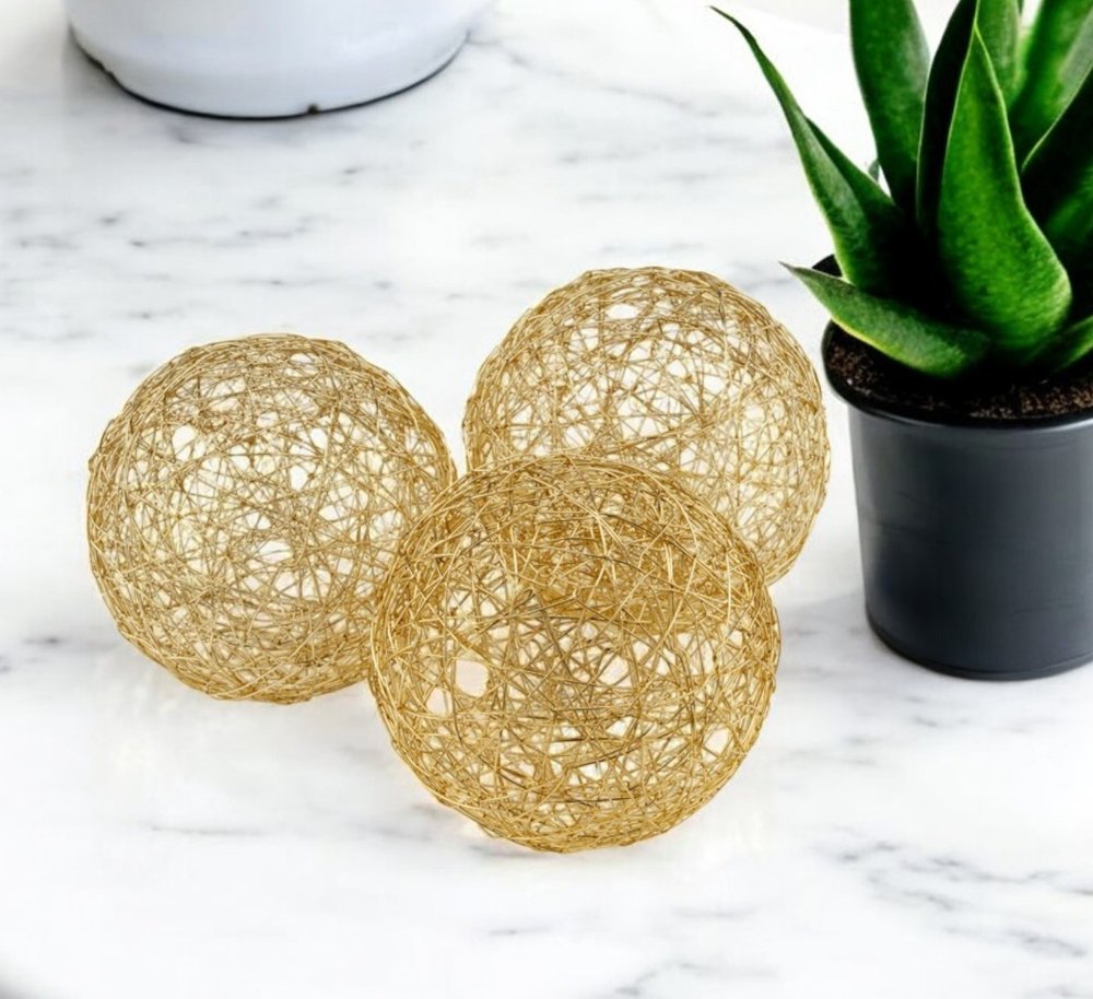 Set of Three Gold Aluminum Decorative Orbs