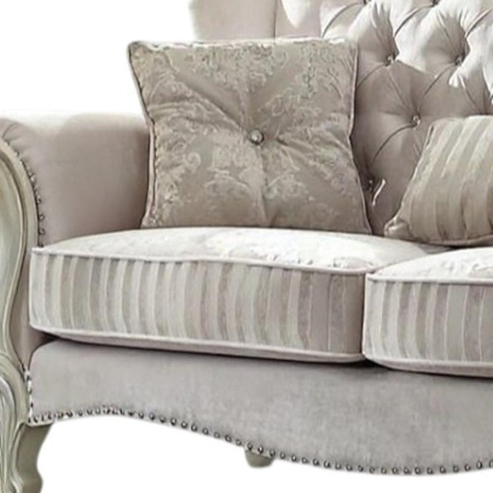 70" Bone And Gold Faux Leather Curved Loveseat