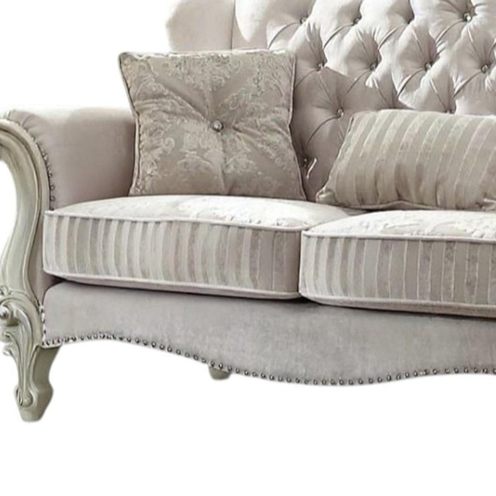 70" Bone And Gold Faux Leather Curved Loveseat
