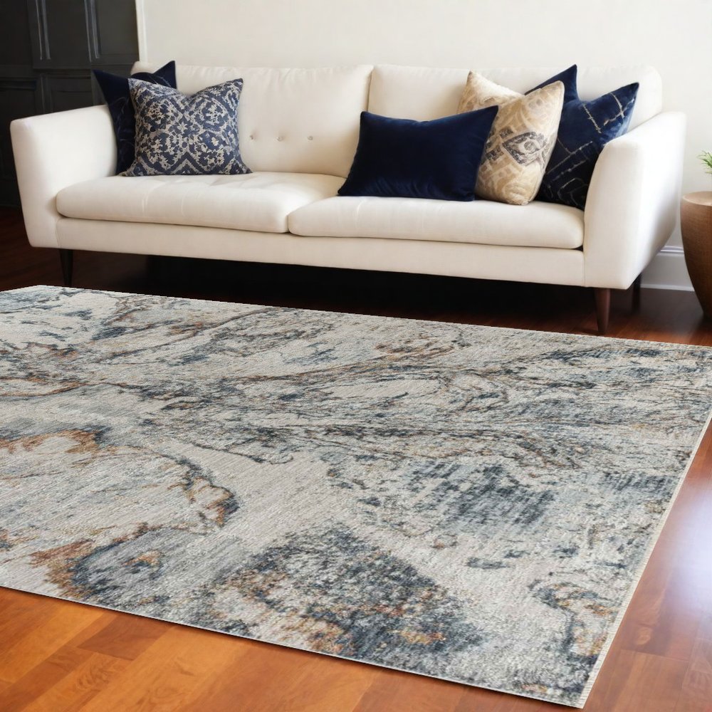 5' X 8' Beige and Blue Abstract Power Loom Area Rug