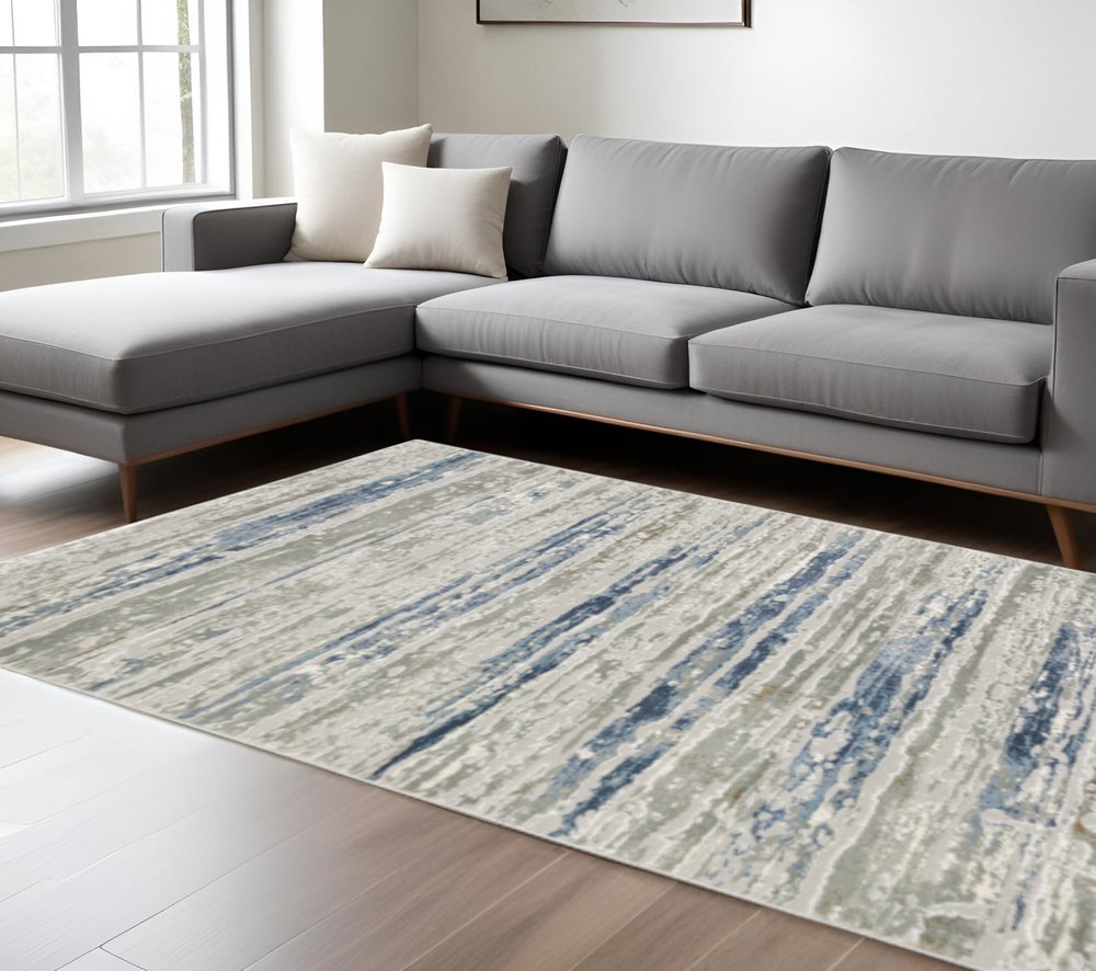 10' X 13' Blue Ivory Grey Light Blue And Brown Abstract Power Loom Stain Resistant Area Rug