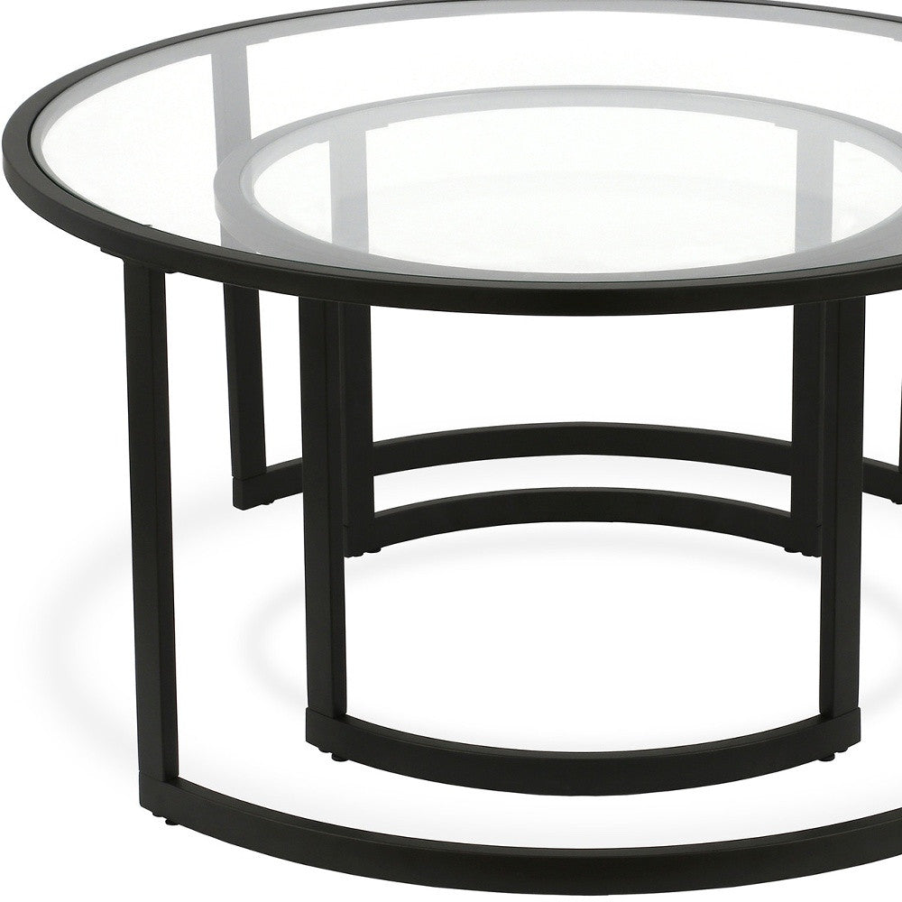 Set of Two Black Glass And Steel Round Sled Nested Coffee Tables