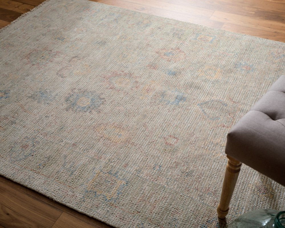 9' X 12' Tan Brown and Blue Floral Hand Woven Distressed Area Rug With Fringe