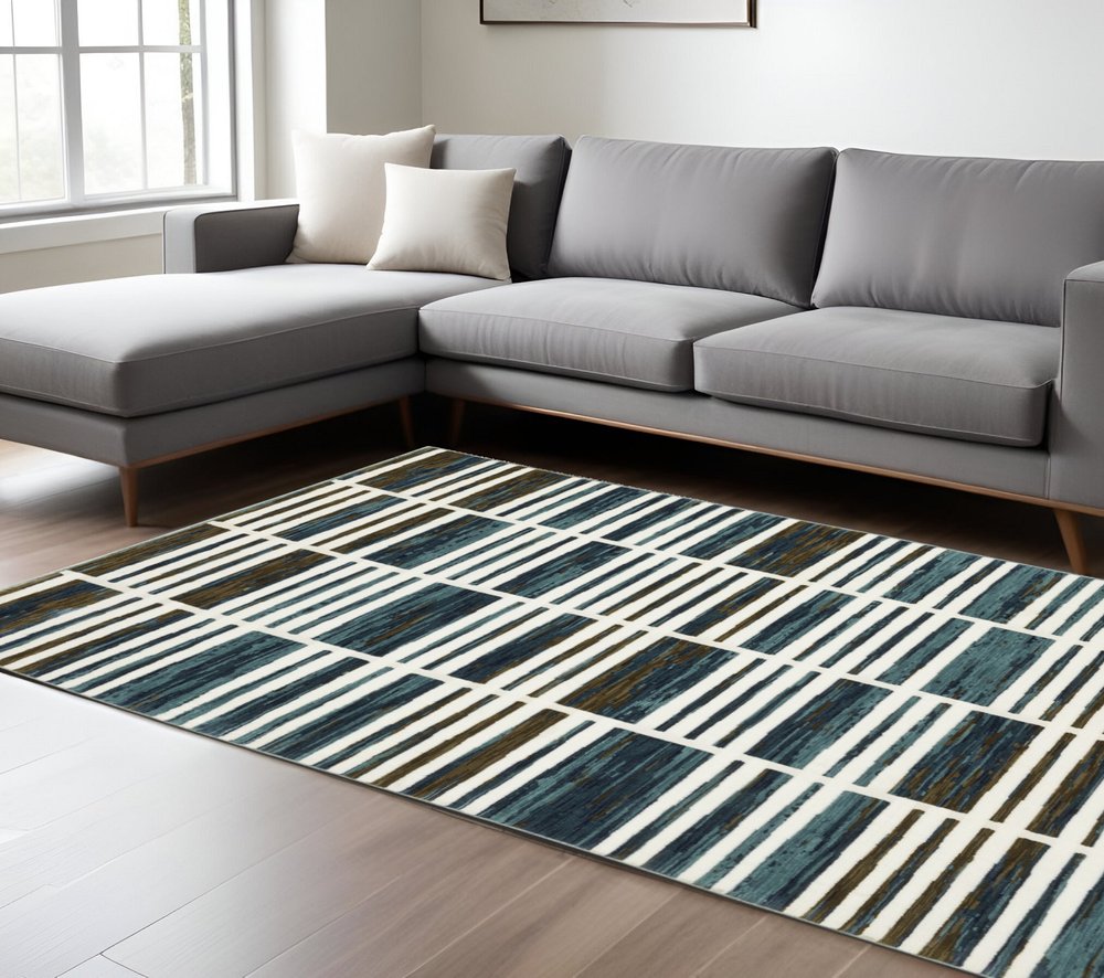 8' X 11' Ivory And Blue Geometric Area Rug
