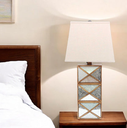 28" Distressed Gold And Silver Metal Bedside Lamp With Beige Shade