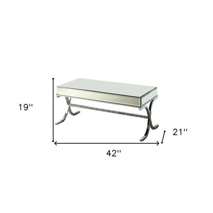 42" Clear and Silver Mirrored Glass And Iron Sled Coffee Table