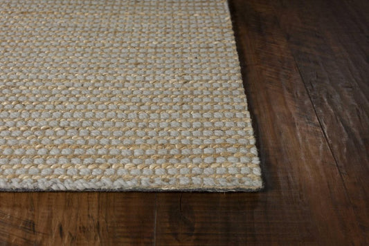 5' X 7' Tan And Ivory Hand Woven Area Rug