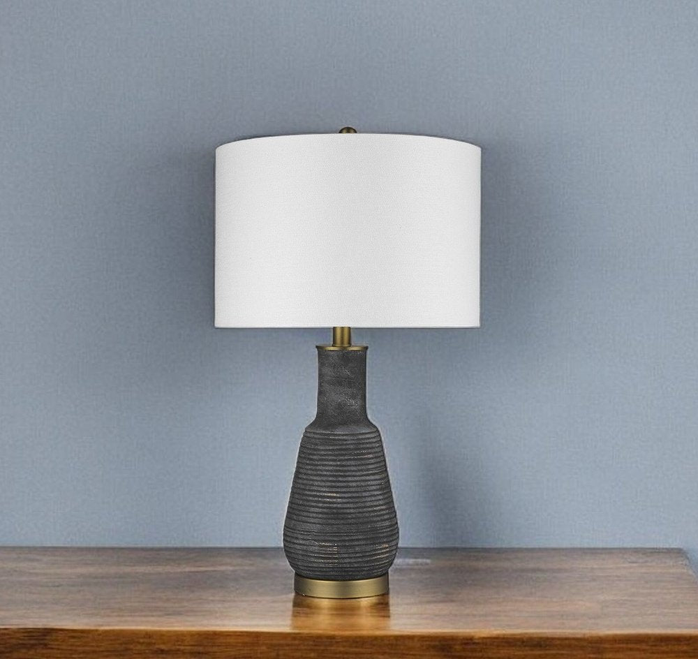 26" Distressed Black and Gold Ceramic Table Lamp With White Drum Shade