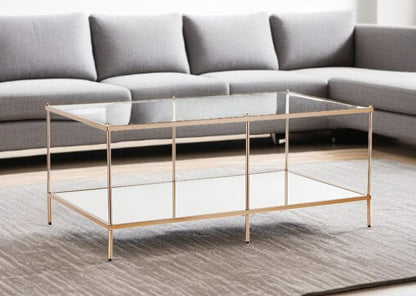 42" Clear And Gold Glass And Metal Coffee Table