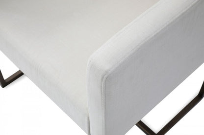 Off White and Antiqued Brass Upholstered Fabric Dining Arm Chair