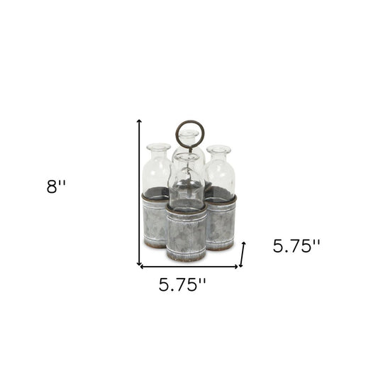 Set of Four Clear Galvanized Metal and Glass Decorative Bottle Tabletop Sculpture