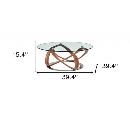 39" Clear and Brown Glass And Solid Wood Round Abstract Coffee Table