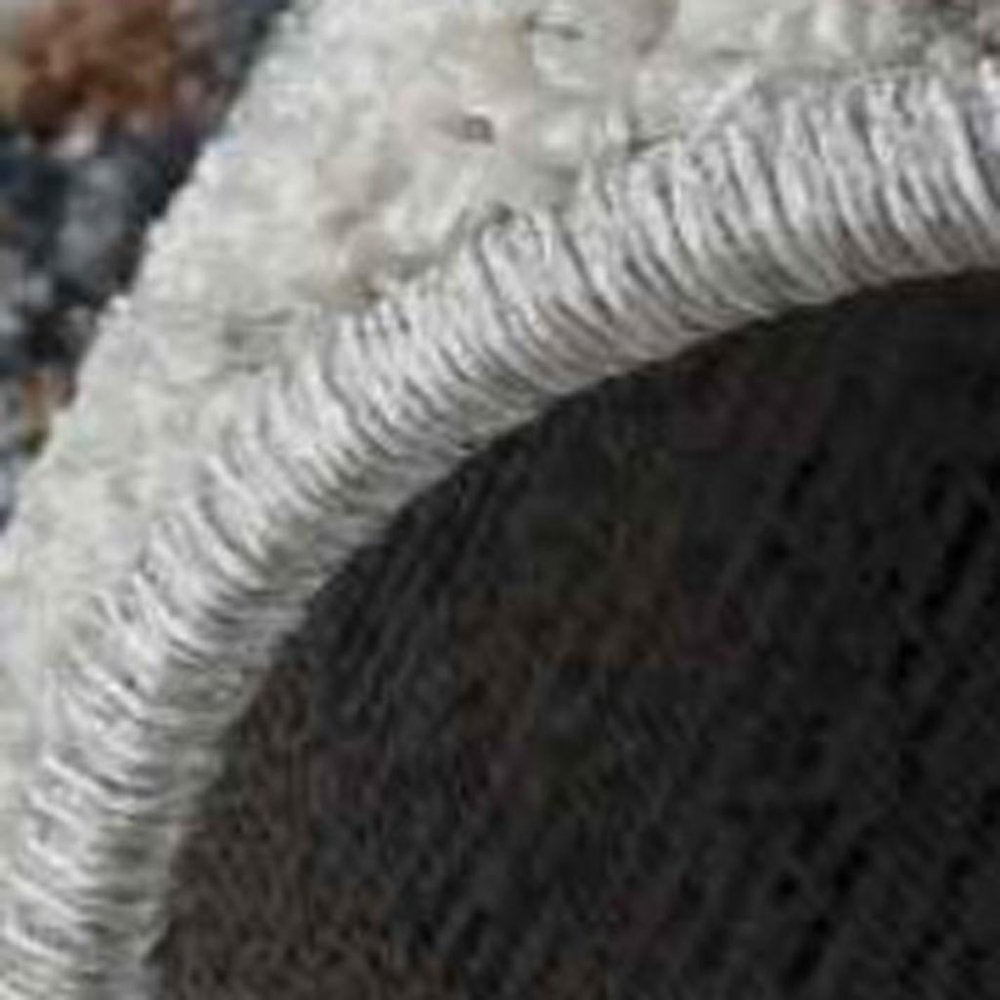 5' X 8' Beige and Blue Abstract Power Loom Area Rug