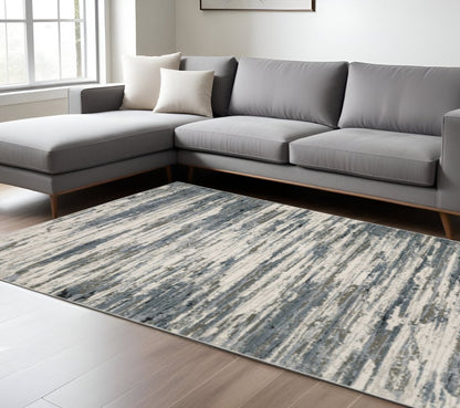 8' X 11' Blue Grey Beige And Brown Abstract Power Loom Stain Resistant Area Rug