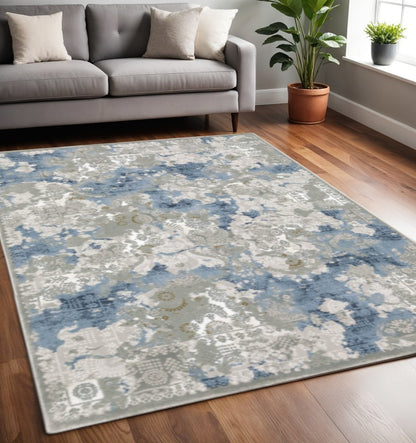8' X 11' Grey Blue Ivory Navy Beige And Brown Abstract Power Loom Stain Resistant Area Rug