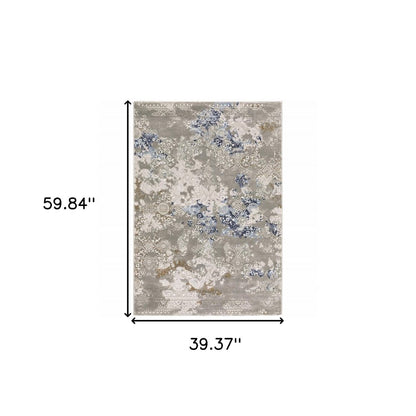 8' X 11' Grey Blue Ivory Brown And Navy Abstract Power Loom Stain Resistant Area Rug