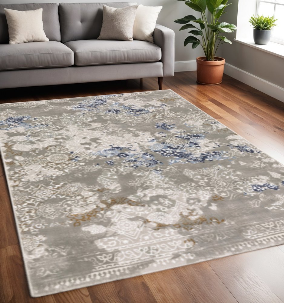 8' X 11' Grey Blue Ivory Brown And Navy Abstract Power Loom Stain Resistant Area Rug