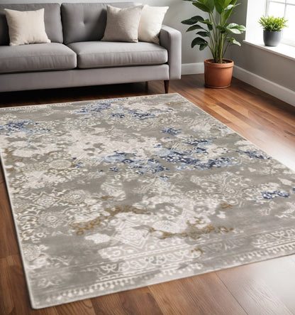 8' X 11' Grey Blue Ivory Brown And Navy Abstract Power Loom Stain Resistant Area Rug