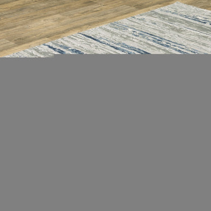 10' X 13' Blue Ivory Grey Light Blue And Brown Abstract Power Loom Stain Resistant Area Rug