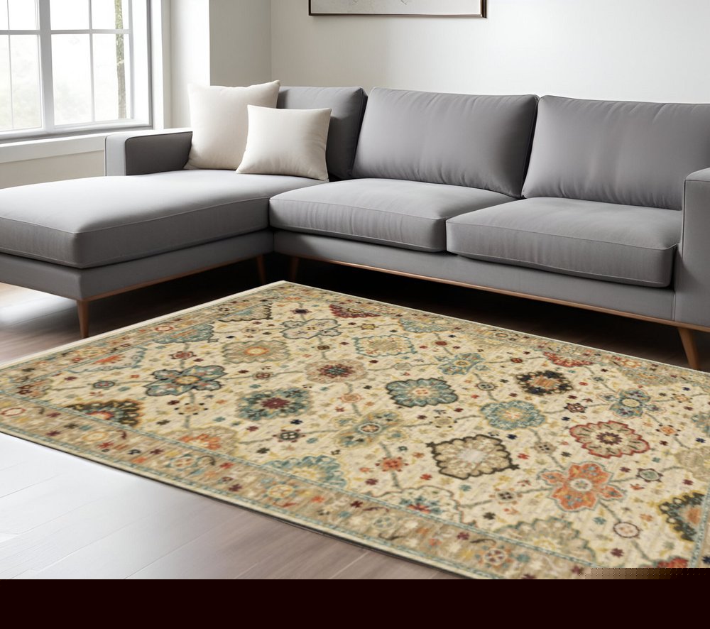 8' X 11' Beige Pale Blue Rust Gold Tan Brown And Orange Oriental Power Loom Stain Resistant Area Rug With Fringe