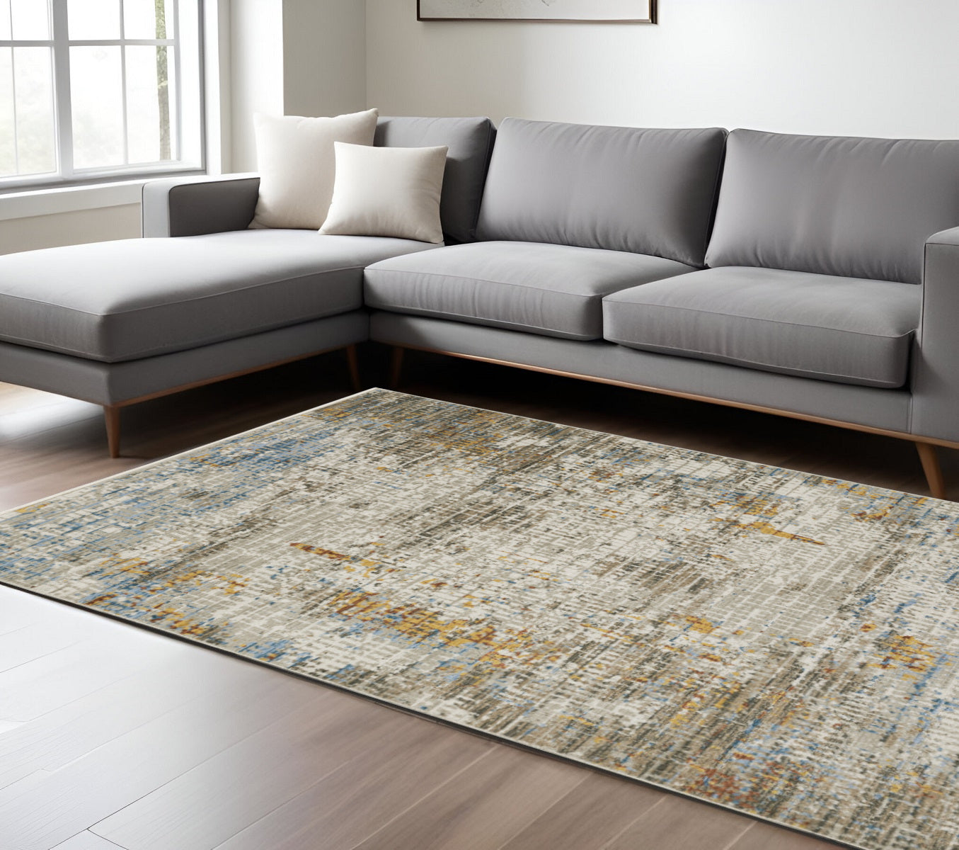 4' X 6' Beige Grey Brown Gold Red And Blue Abstract Power Loom Stain Resistant Area Rug With Fringe