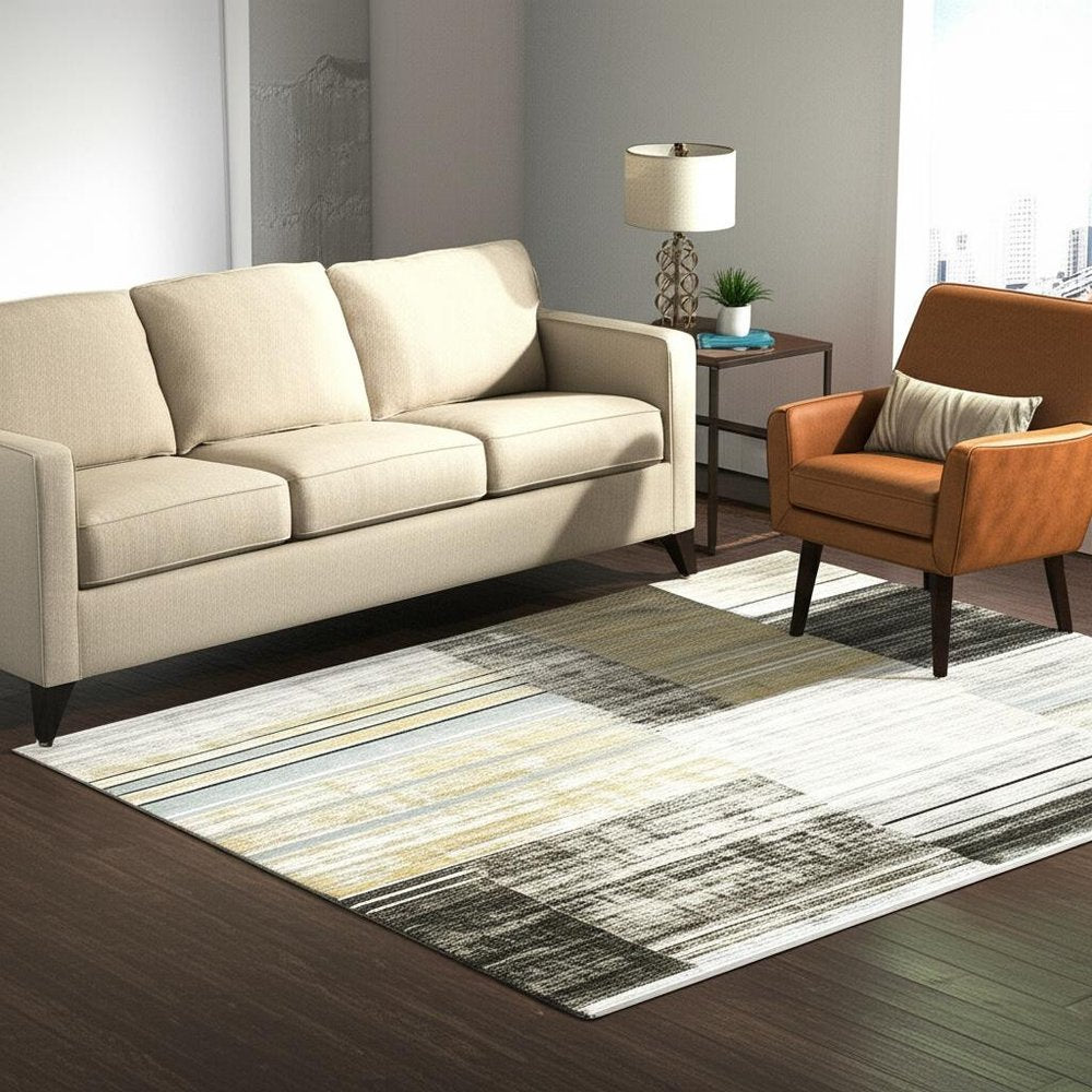 10' X 13' Beige Charcoal Brown Grey Tan Gold And Blue Geometric Power Loom Stain Resistant Area Rug With Fringe