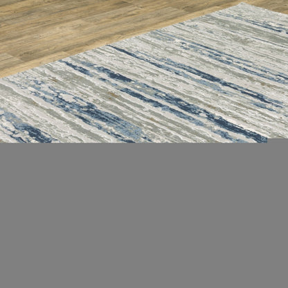 10' X 13' Blue Ivory Grey Light Blue And Brown Abstract Power Loom Stain Resistant Area Rug