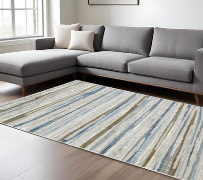 6' X 9' Grey Blue Ivory Brown Beige And Navy Abstract Power Loom Stain Resistant Area Rug