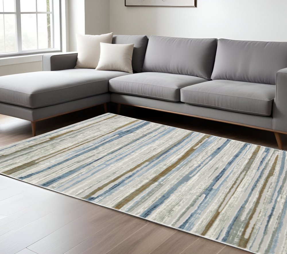 6' X 9' Grey Blue Ivory Brown Beige And Navy Abstract Power Loom Stain Resistant Area Rug