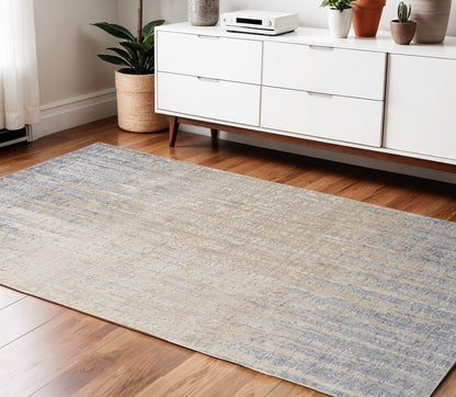 4' X 6' Tan And Blue Abstract Distressed Area Rug