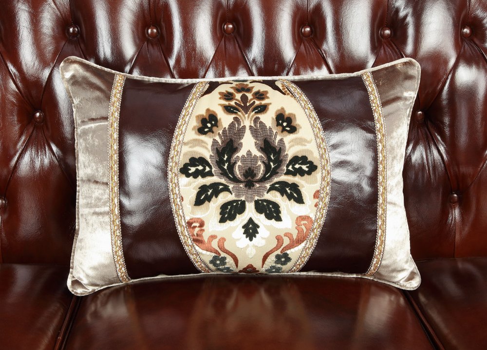 69" Brown And Walnut Top Grain Leather Curved Loveseat and Toss Pillows