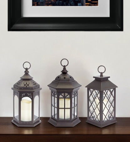 Set of Three Dark Brown Distressed Ornate Glass And Plastic Floor Lantern Candle Holders With Candle