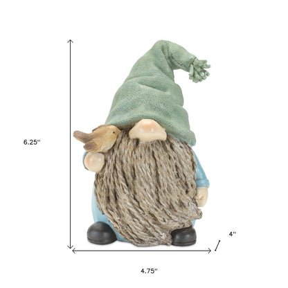 Set of Four Blue and Green Polyresin Christmas Figurine Tabletop Sculpture