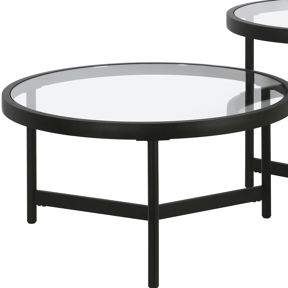 Set of Two 30" Black Glass And Steel Round Nested Coffee Tables