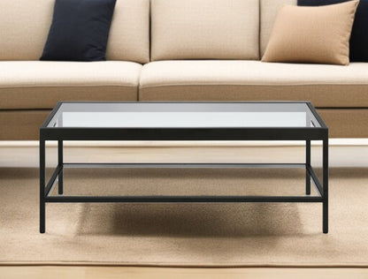45" Clear And Black Glass And Steel Coffee Table With Shelf