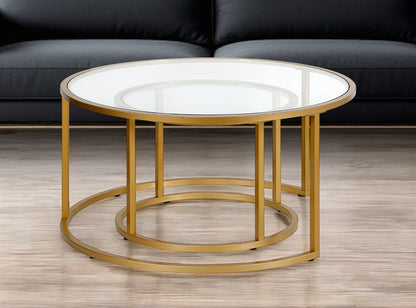 Set of Two 35" Gold Glass And Steel Round Nested Coffee Tables