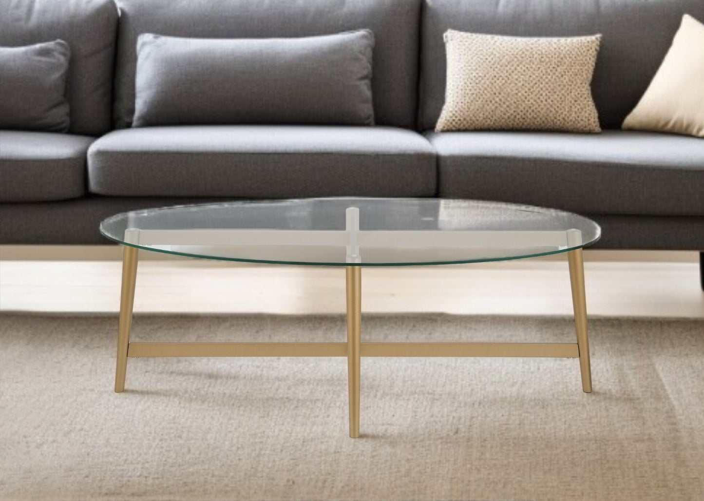 50" Clear And Gold Glass And Steel Oval Coffee Table