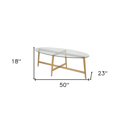 50" Clear And Gold Glass And Steel Oval Coffee Table