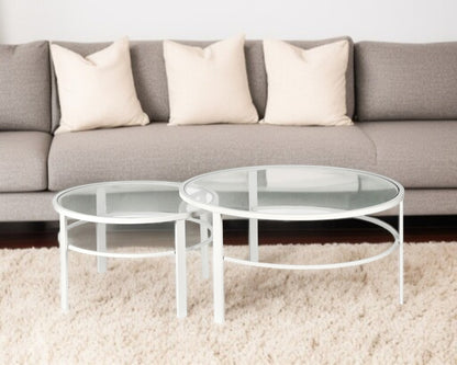 Set of Two 36" White Glass And Steel Round Nested Coffee Tables