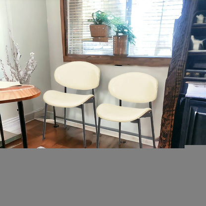 Set of Two Off White and Black Upholstered Faux Leather Curved Back Dining Side Chairs