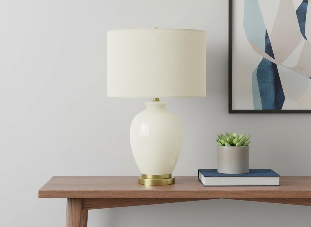 26" Gold and Ivory Ceramic Urn Table Lamp With Cream Drum Shade