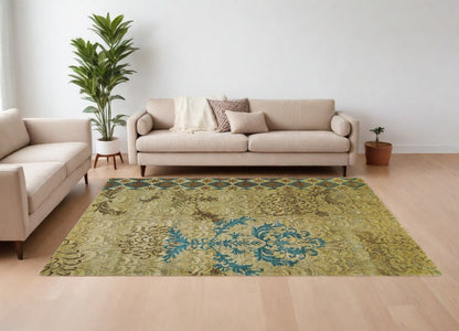 8' X 10' Tan Blue and Brown Floral Hand Knotted Area Rug