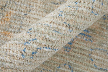 9' X 12' Tan Brown and Blue Floral Hand Woven Distressed Area Rug With Fringe