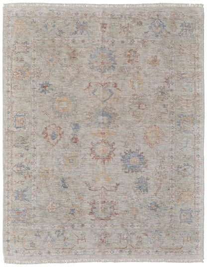 9' X 12' Tan Brown and Blue Floral Hand Woven Distressed Area Rug With Fringe