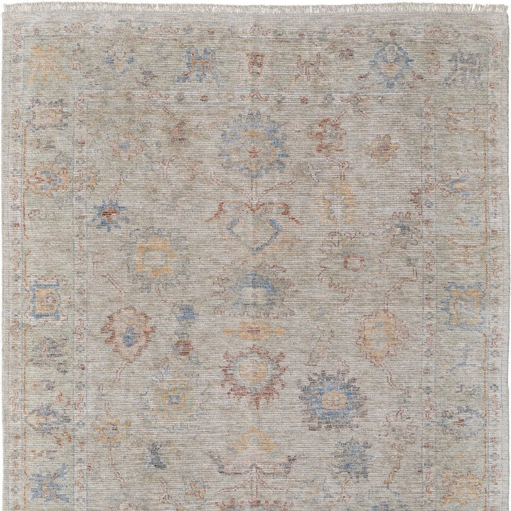 9' X 12' Tan Brown and Blue Floral Hand Woven Distressed Area Rug With Fringe