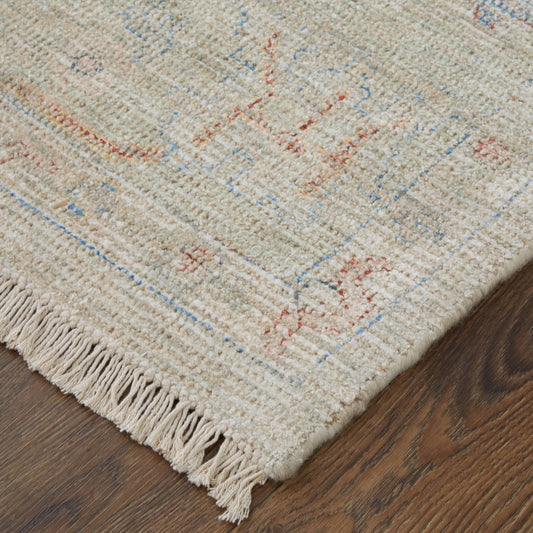 4' X 6' Tan Brown and Blue Floral Hand Woven Distressed Area Rug With Fringe