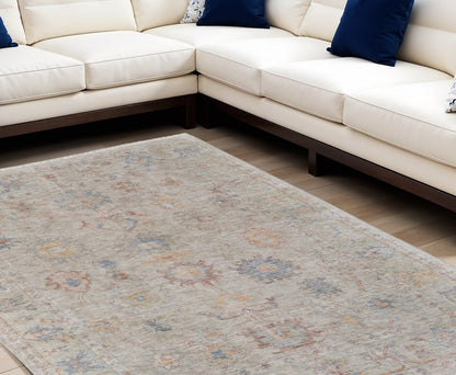 4' X 6' Tan Brown and Blue Floral Hand Woven Distressed Area Rug With Fringe