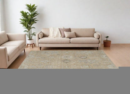 9' X 13' Tan and Ivory Wool Floral Hand Knotted Area Rug