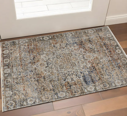 3' X 5' Tan Blue And Burnt Orange Oriental Area Rug With Fringe