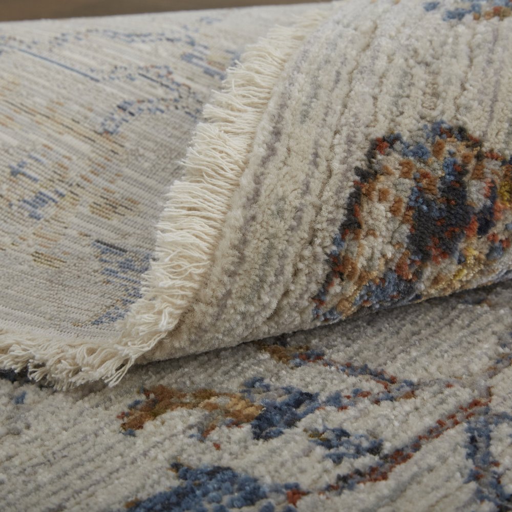 3' X 5' Ivory Blue And Burnt Orange Floral Distressed Area Rug With Fringe